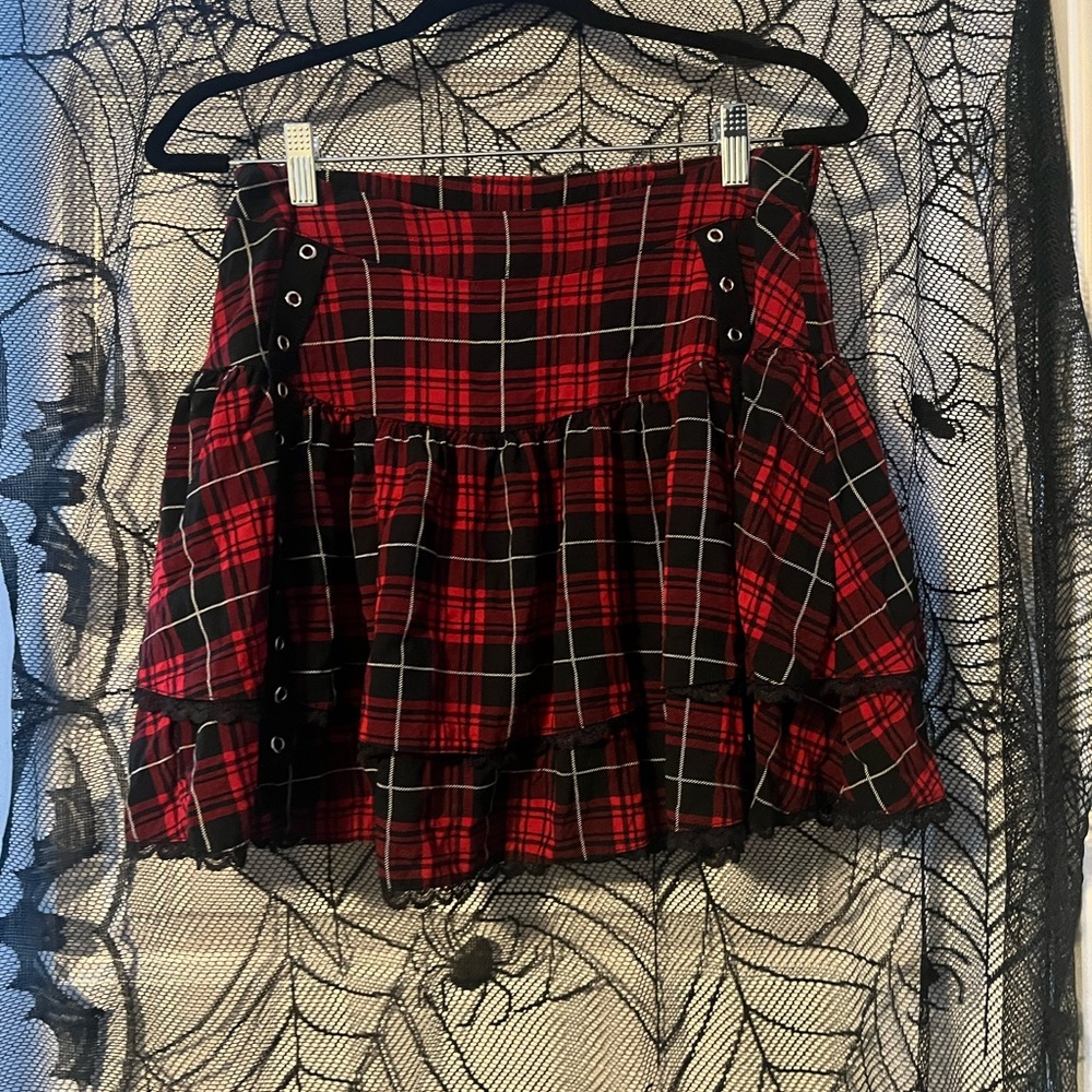 Plaid red skirt with eyelet details